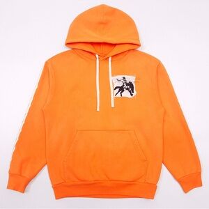Bold Orange Sweatshirt with Graphic Patch